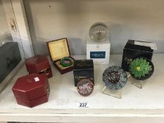 A quantity of mainly boxed glass paperweights,