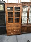 A modern cottage style glazed top bookcase