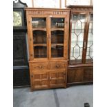 A modern cottage style glazed top bookcase