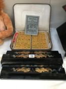 A mid 20th century Mah Jong board in case with 4 stands