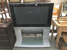 A large Panasonic tv on stand (remote in office)