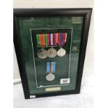 A framed set of 4 medals awarded to 1157905 WO2 L.M.