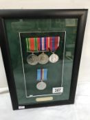 A framed set of 4 medals awarded to 1157905 WO2 L.M.