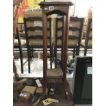 An Edwardian mahogany plant stand