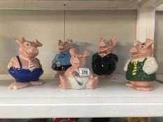 A set of 5 Nat West Wade pigs family money boxes