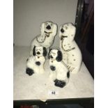 A pair of Staffordshire mantlepiece dogs and a smaller pair
