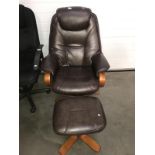 A reclining leather swivel chair and footstool