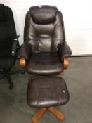 A reclining leather swivel chair and footstool