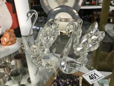 3 glass crystal swan ornaments and a unicorn