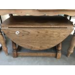 A solid oak drop leaf coffee table