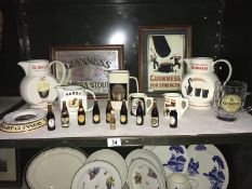 A mixed lot of Guinness items including jugs, tankard etc.