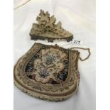 A tapestry bag with mirror and soapstone carving