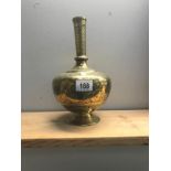 A Persian brass vase