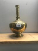 A Persian brass vase