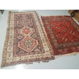 2 x floor Rugs, 1 red ground fringed 1.28 x 1.68 & 1 smaller beige ground with red and navy