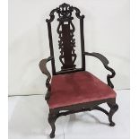 Late 19th C mahogany low seated Armchair, a decorative pediment with splat back, curved arms,