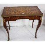 Continental Marquetry Decorated Desk, the serpentine shaped and brass banded top above a sliding