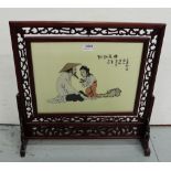 1960s Chinese Table Screen, the pivoting glass panel painted with a girl presenting a frog, in a