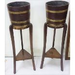 Pair of Oak Planters (each 10” dia x 9”h), brass banded, on removable stands (29”h)