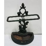 Cast Iron Stick Stand, with vine décor, bow shaped tray, painted green, 17”w x 23”h