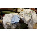 3 bags and 1 basket of mainly white and cream linen – table cloths, napkins, aprons etc