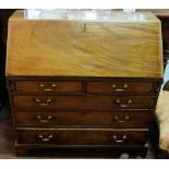 Georgian Mahogany Slope front Bureau, the hinged top opening to an arrangement of compartments, over