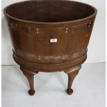 Mahogany oval shaped Wine Cooler, double brass banding, with metal liner, on 4 Queen Anne feet (