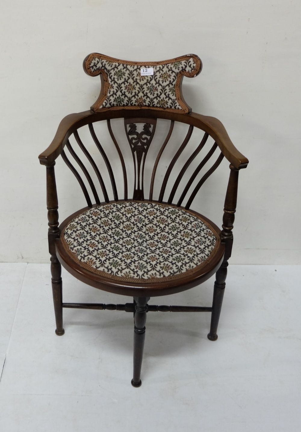 Mahogany Bow-shaped Armchair, with padded back and seat, spindle shaped legs