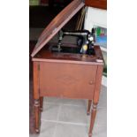 Singer Hand Sewing Machine, in a stand with compartment and various sewing accessories.