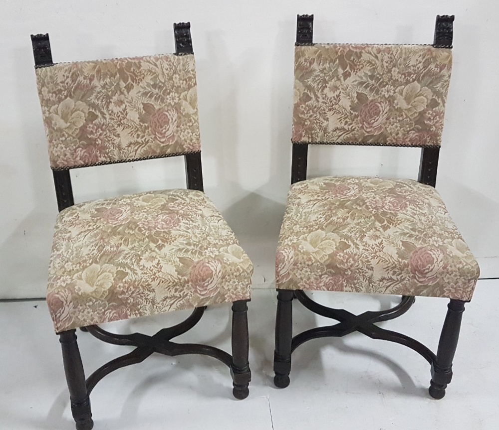 Pair of early 20thC Oak Side Chairs, with padded backs and seats, with Bacchus design finials,