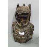 Carved Tribal Figure of a Woman Wearing a Native Headdress and Costume, 13”h x 8.5”w