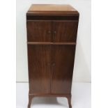 Early 20th C mahogany Music Cabinet with a hinged lid and drawer above a cabinet with 4 sliding