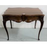 Edwardian Mahogany Side Table, with a shaped serpentine top and a decoratively carved apron, on 4