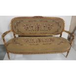 Continental Carved Wood Sofa, painted gold, with side arms and turned legs, floral needlepoint