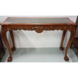 Mahogany Console / Centre Table with decorative apron on both sides, inset with a glass top, 54”w