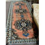 Terracotta ground Persian Runner / Floor Rug, with a treble medallion design, full pile (no signs of