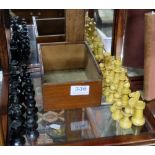 Complete Set of turned wood Chess Pieces (1 ebonised), from 4cm to 9cm high, in a pine box