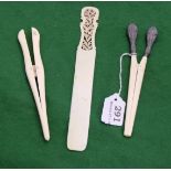 Two Ivory Gloves Stretchers and a Bone Page Turner with fretwork handle (3)