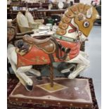 Carved and painted unusual carousel horse, in the style of medieval horse with 2 raised lions to
