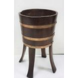 Circular mahogany Plant Stand in the form of a bucket with 3 brass bands, fixed on 4 splayed legs,