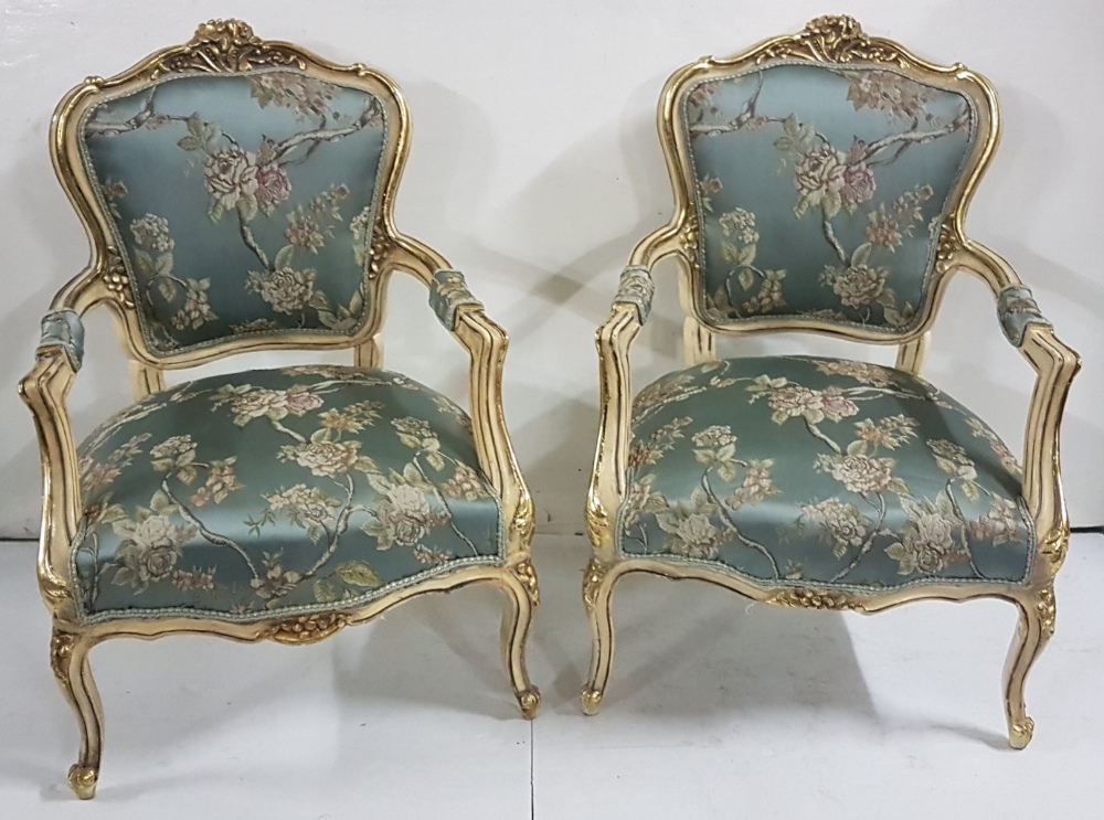 Matching pair of decorative carved wood Armchairs, cream with gold highlights with floral design