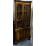 Modern curved mahogany finish Bookcase (reproduction) with 2 upper Gothic glazed doors over 2