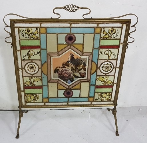 Late 19th C Firescreen, brass framed with stained glass coloured panes featuring flowers and a