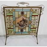 Late 19th C Firescreen, brass framed with stained glass coloured panes featuring flowers and a