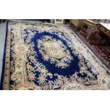 Blue ground Chinese Wool Carpet, with central floral medallion and floral borders, 3.7m x 2.8m