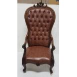 Late Victorian Rosewood Framed Library Armchair, the shaped high back mounted with a pediment,