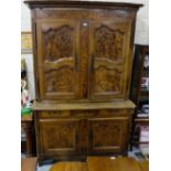 17th C French walnut Armoire, the 2 upper panelled shaped doors supported on 2 heavy external