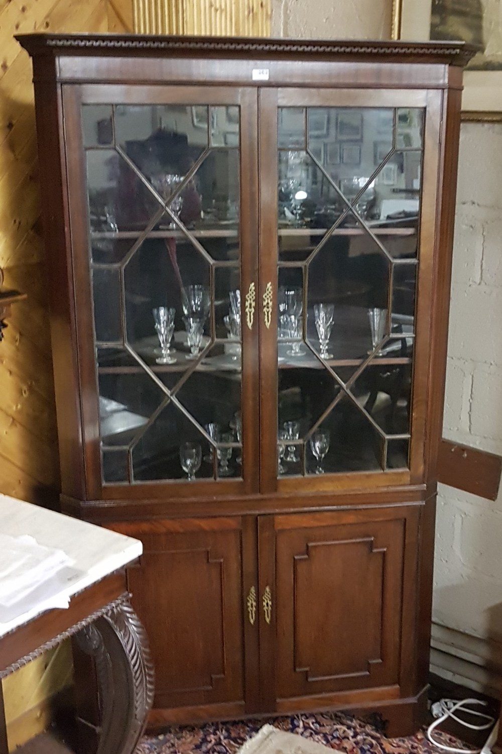 Late 19thC Mahogany Corner Cabinet, the two astragal glazed upper doors over two panelled doors