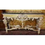 Ornately Carved Regency Style Console Table, the black marble top over an ornately carved and raised