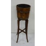 Circular Oak Plant Bucket (brass bound) on matching stand, (Alsops, Bristol), 99cm h and 2 plant